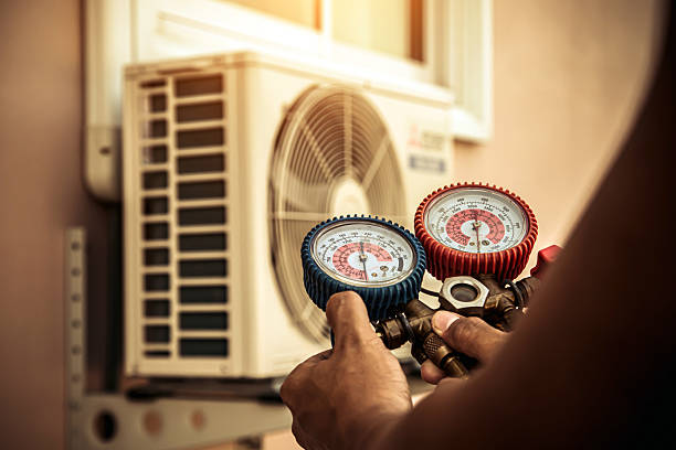 Professional Air Conditioning Service technician working in Uniondale, IN